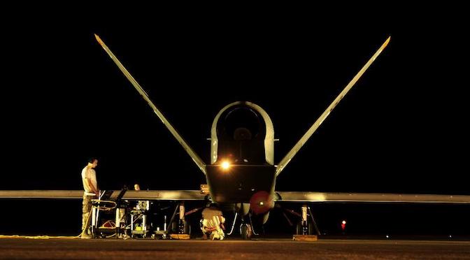 A military drone photographed at night