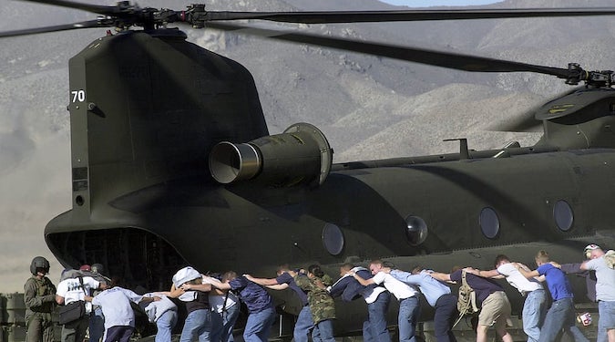 non-combatants loaded onto a helicopter
