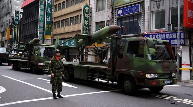 A Taiwanese soldier next to a drone