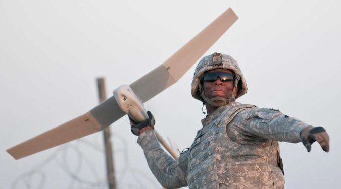 A soldier launching a drone